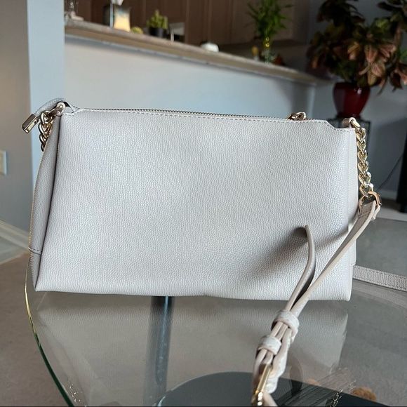 Crossbody purse color cream with multiple pockets on inside from Dune - Picture 3 of 7